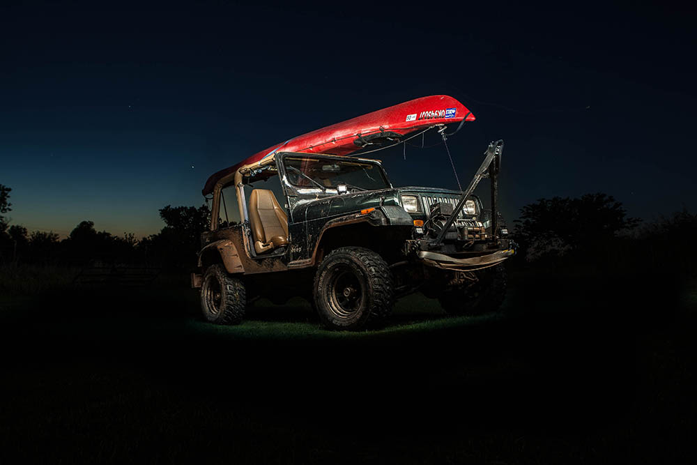 kayak on top of black off-road vehicle_TannerSheltry_Unsplash