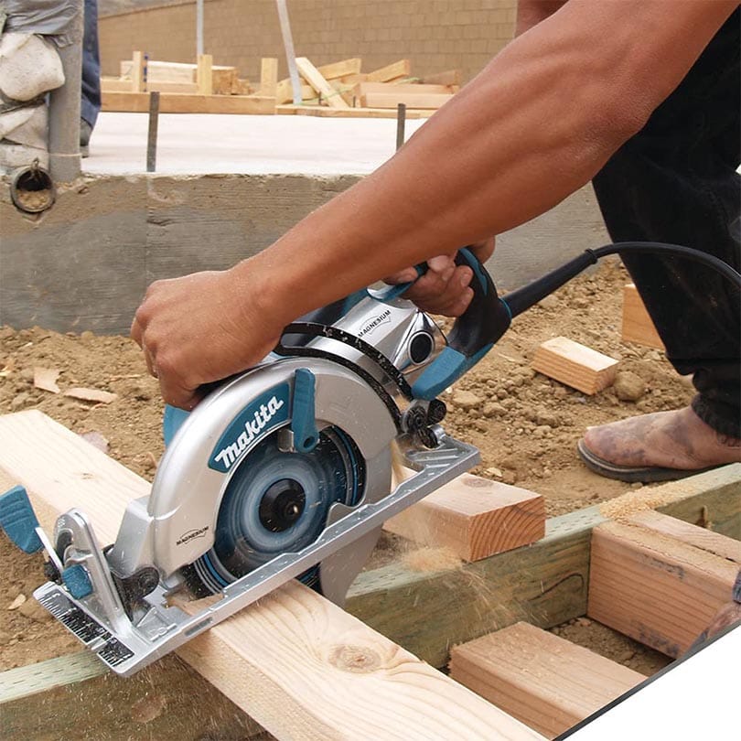 man using Makita 5377MG 7-1:4 Magnesium Hypoid Saw