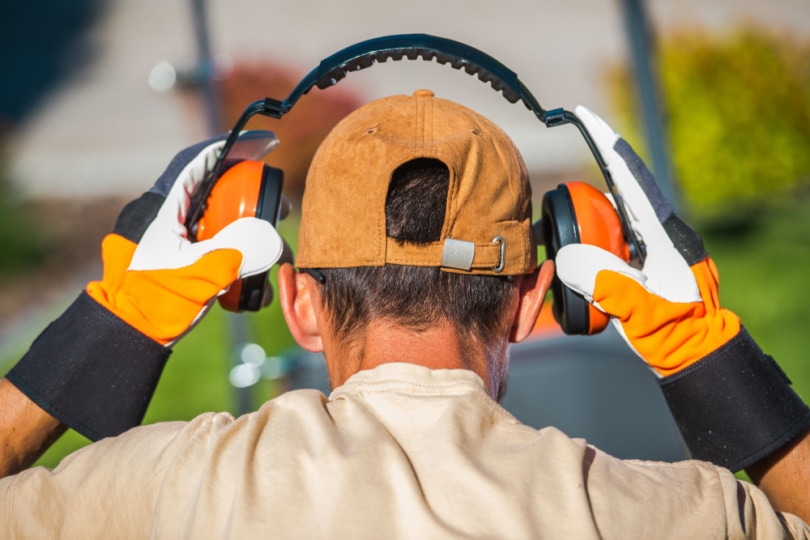 man wearing ear muffs
