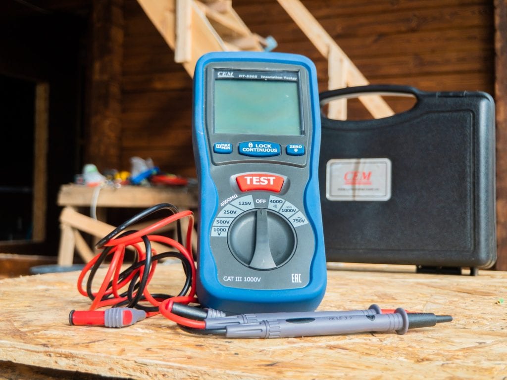 multimeter on a wood surface