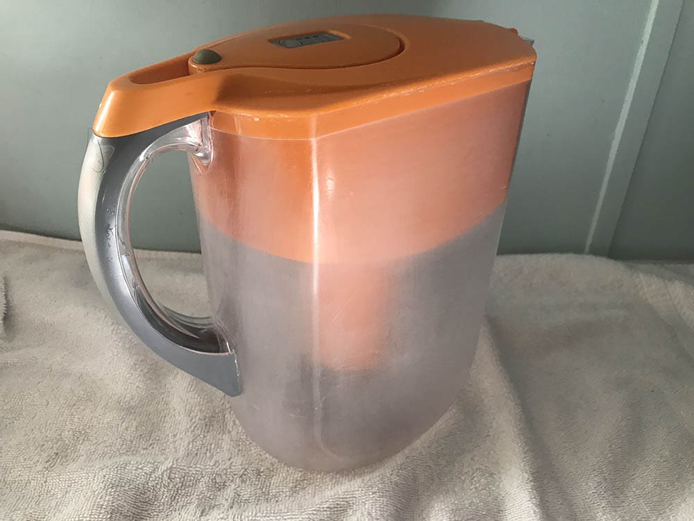 old and dirty orange brita water pitcher
