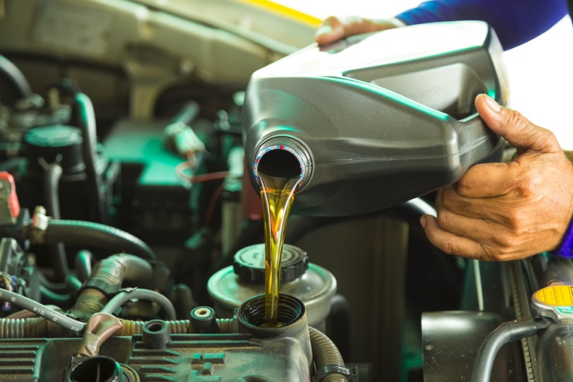 pouring engine oil