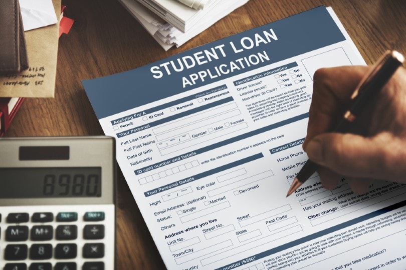 student filling out student loan application form