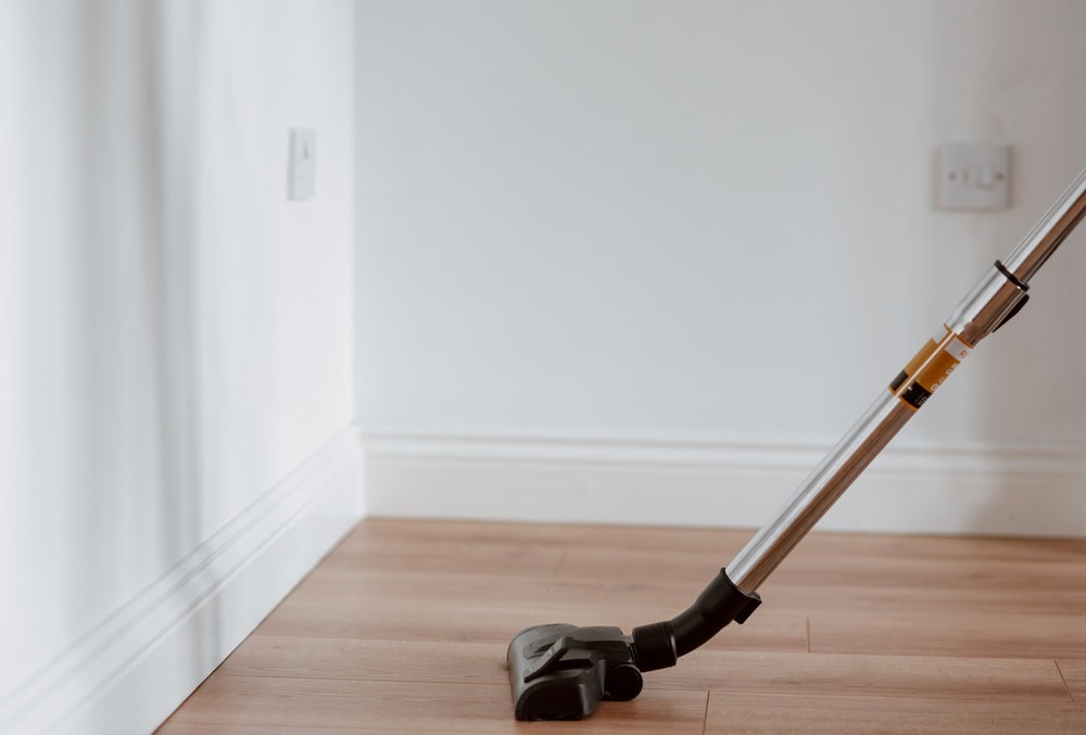 vacuum cleaner in a wood floor