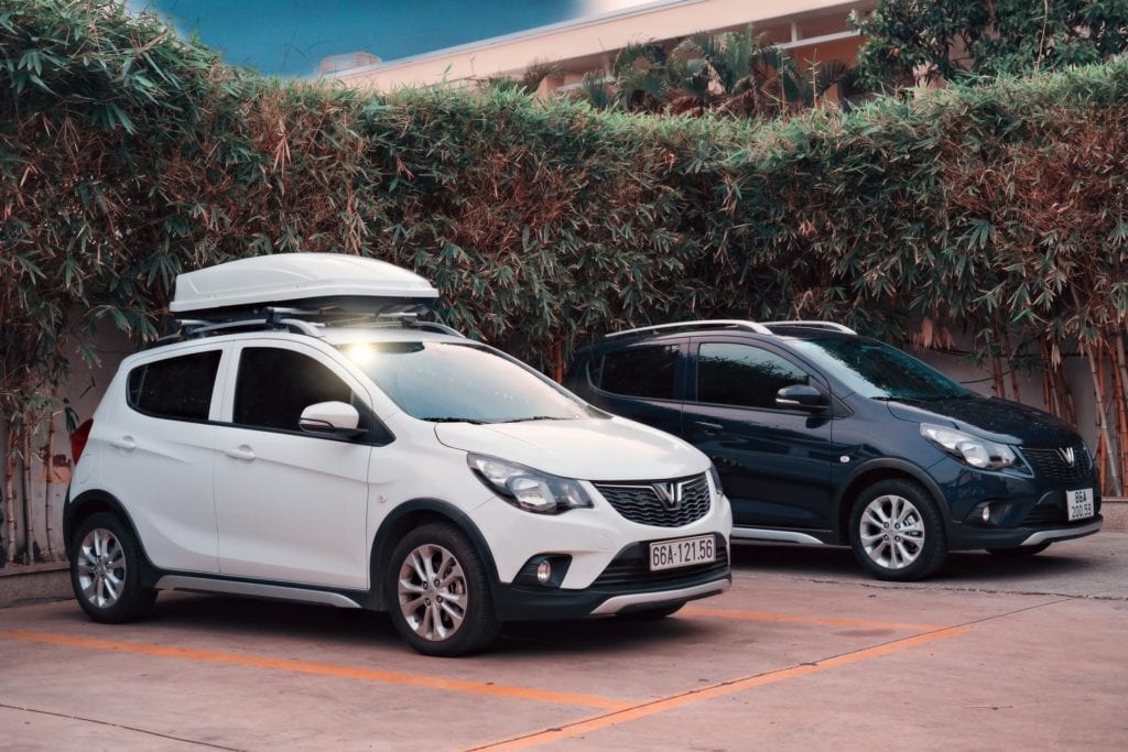 white and black car with roof cargo box