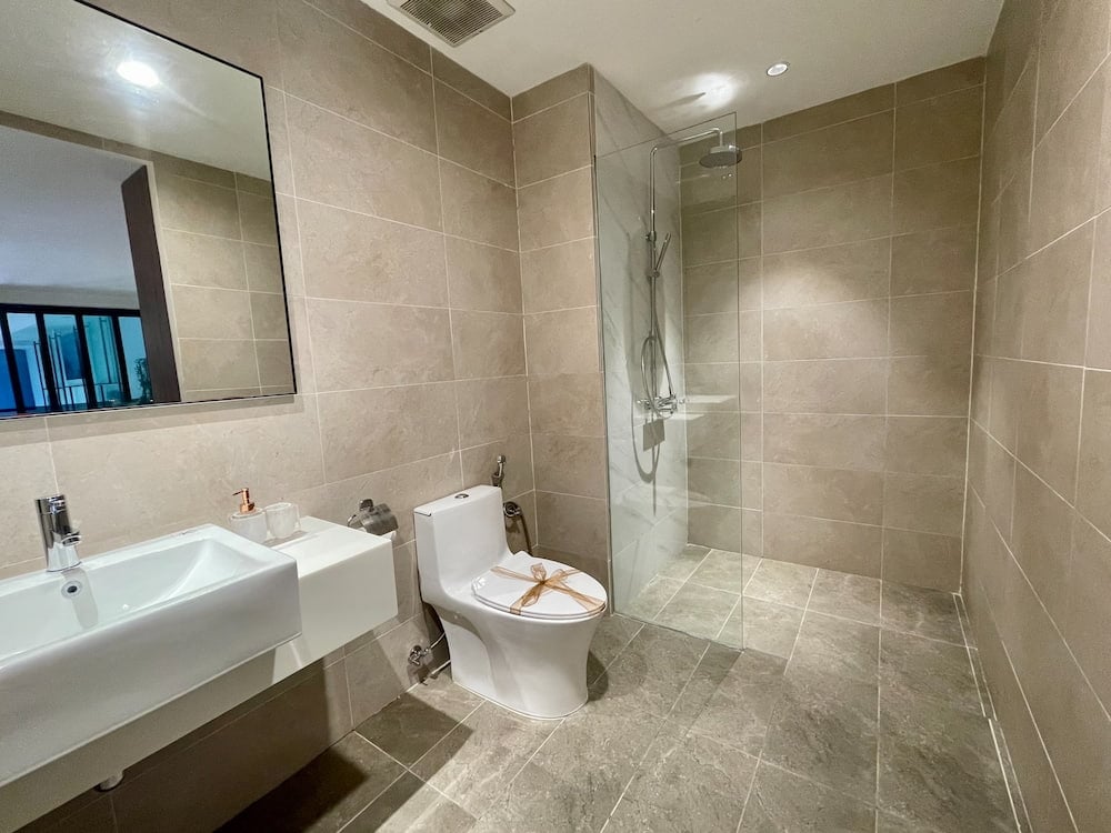 white ceramic toilet and sink in a bathroom