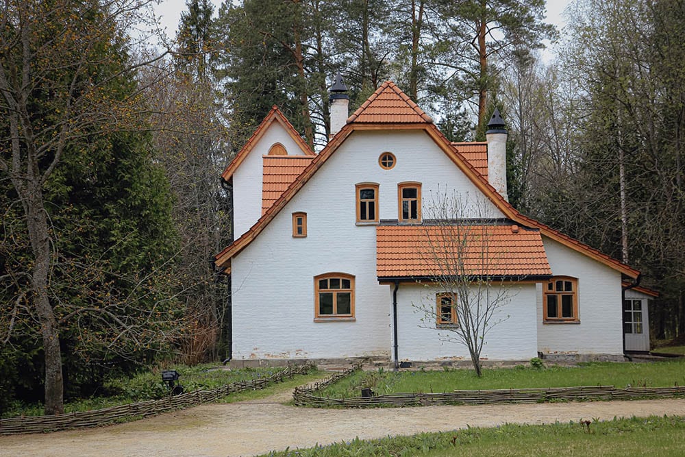 white house with brown roof