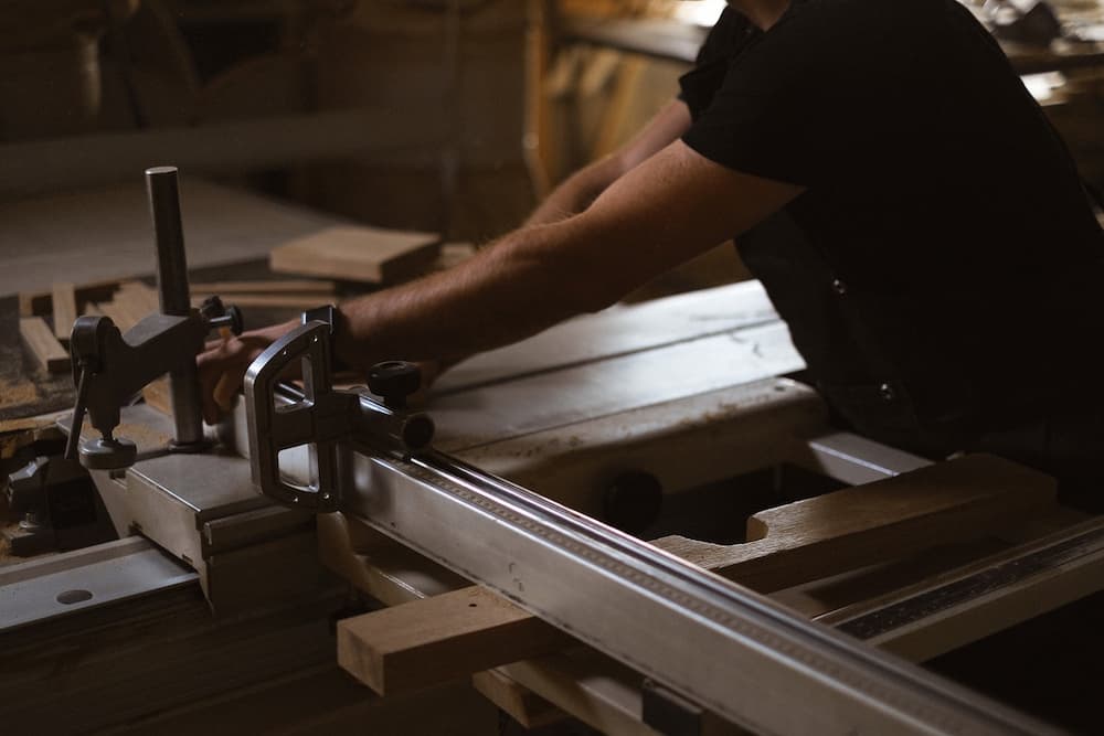 woodworket cutting a metal