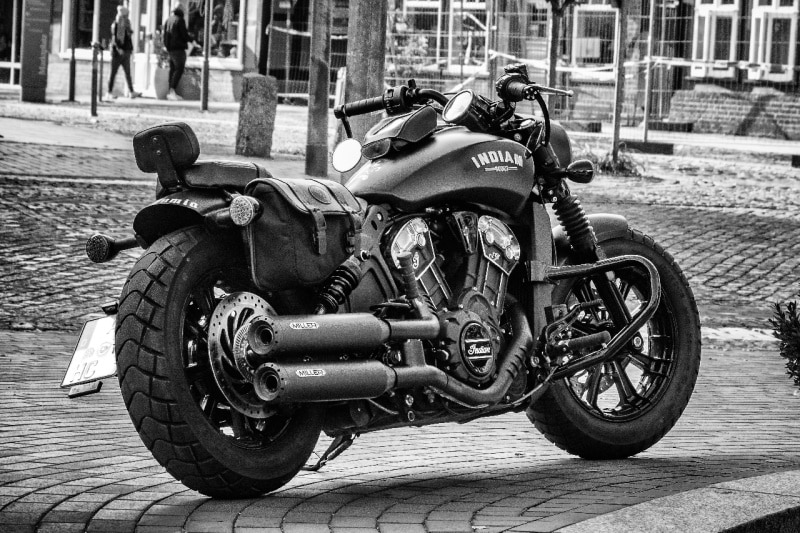Big black motorcycle with tracker handlebars