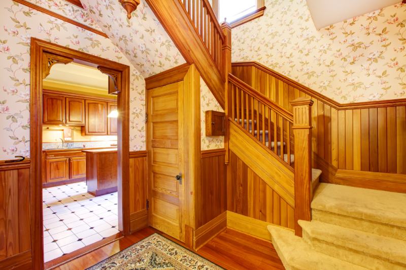 Hallway with staircase near entrance craftsman style home with lots of wood detail