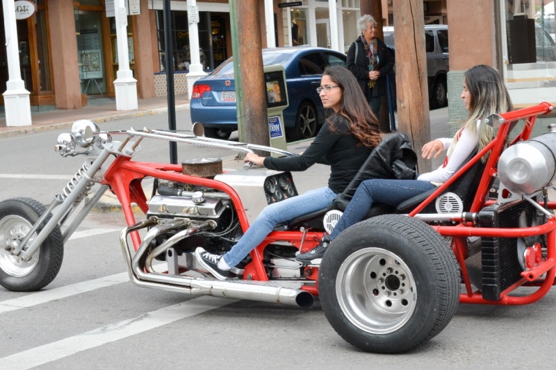 Two ladies on a big bike with cruiser handlebars