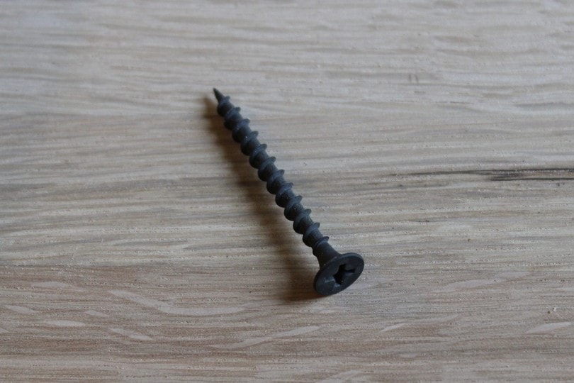 a black drywall screw