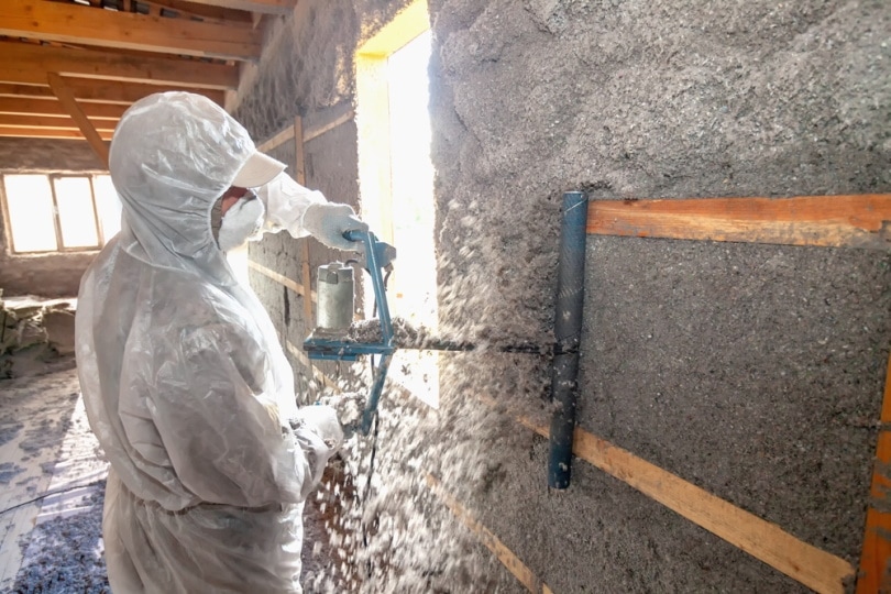 man making cellulose insulation