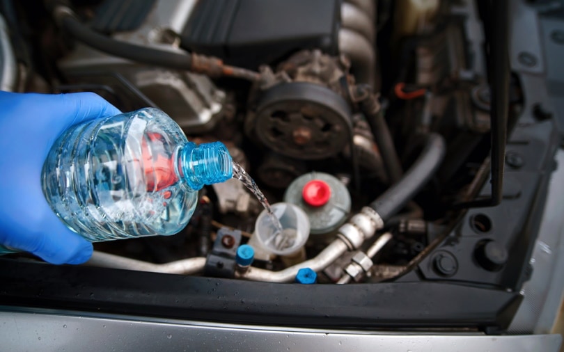 pouring wiper fluid