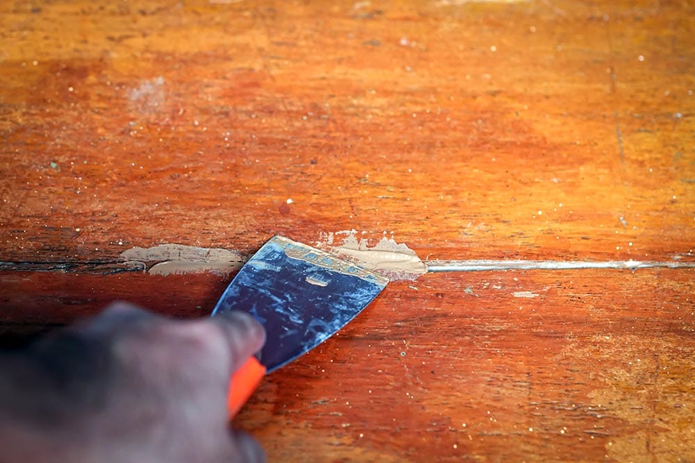 putting wood filler on a cracked wood