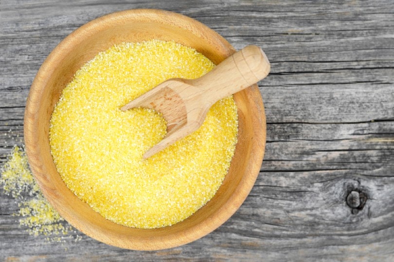 top view of cornmeal in a wooden bowl