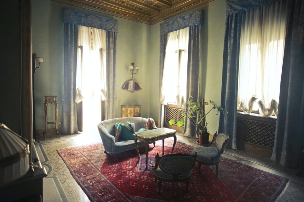 woman reading a book in a living room