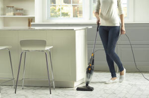 woman using a lightweight vacuum cleaner