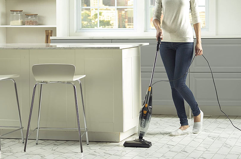 woman using a lightweight vacuum cleaner