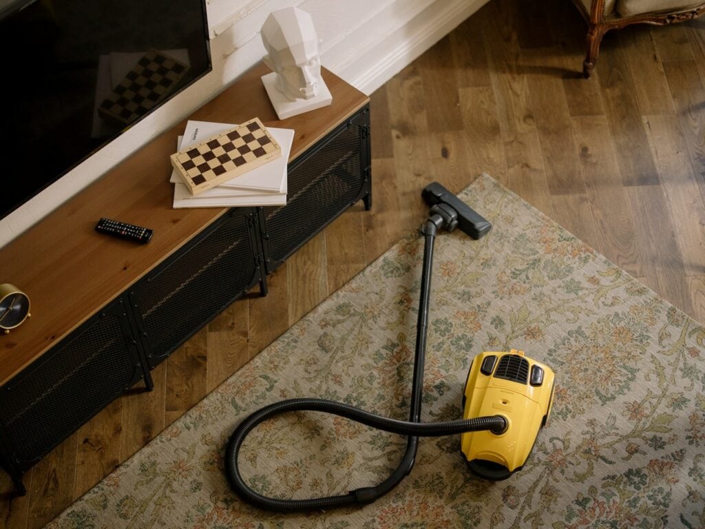 yellow and black vacuum cleaner on the floor