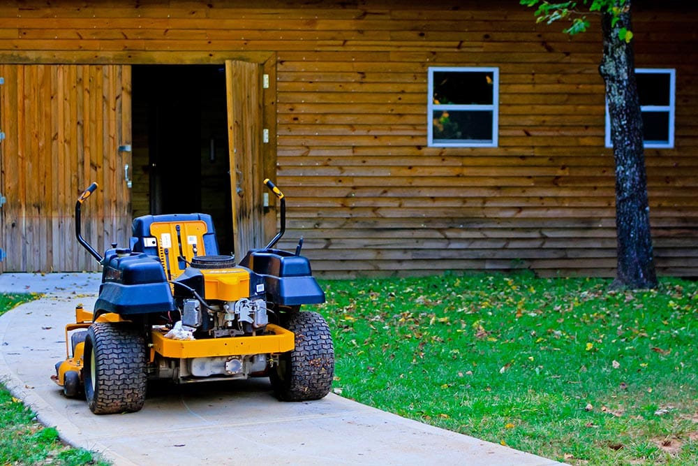 yellow zero turn mower parked