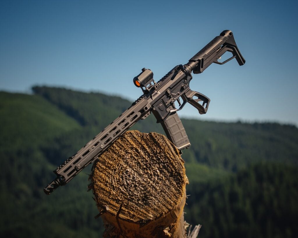 Assault rifle on brown wood