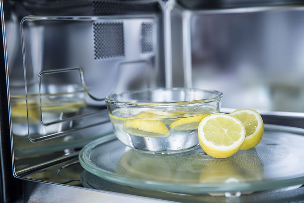 Cleaning a microwave oven with water and lemon