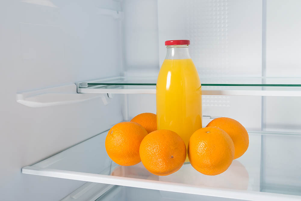 Orange juice inside refregerator_Aleksey Kurguzov_Shutterstock