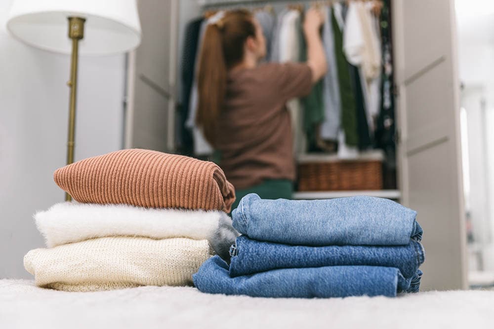 Woman decluttering-her wardrobe