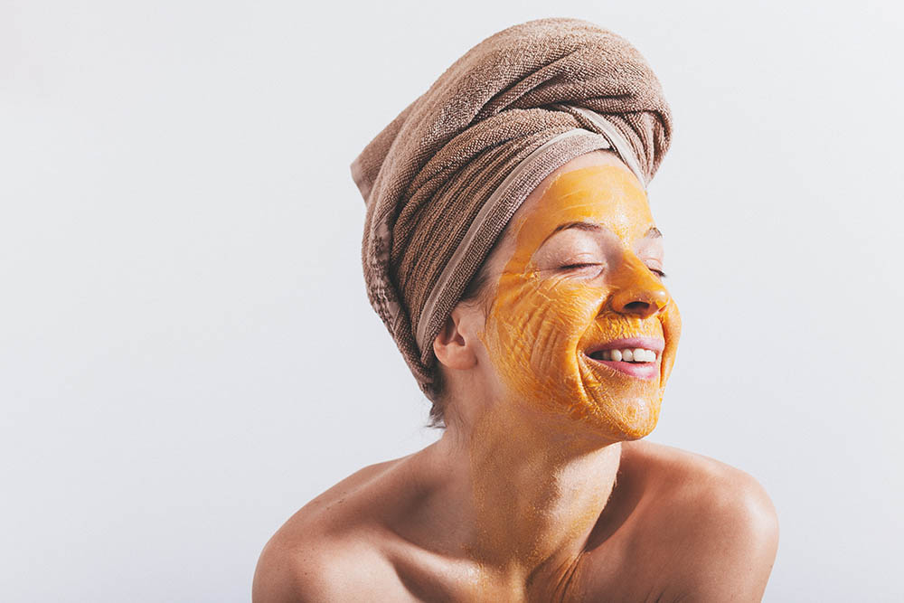Young woman with an egg mask on her face_Marjan Apostolovic_Shutterstock