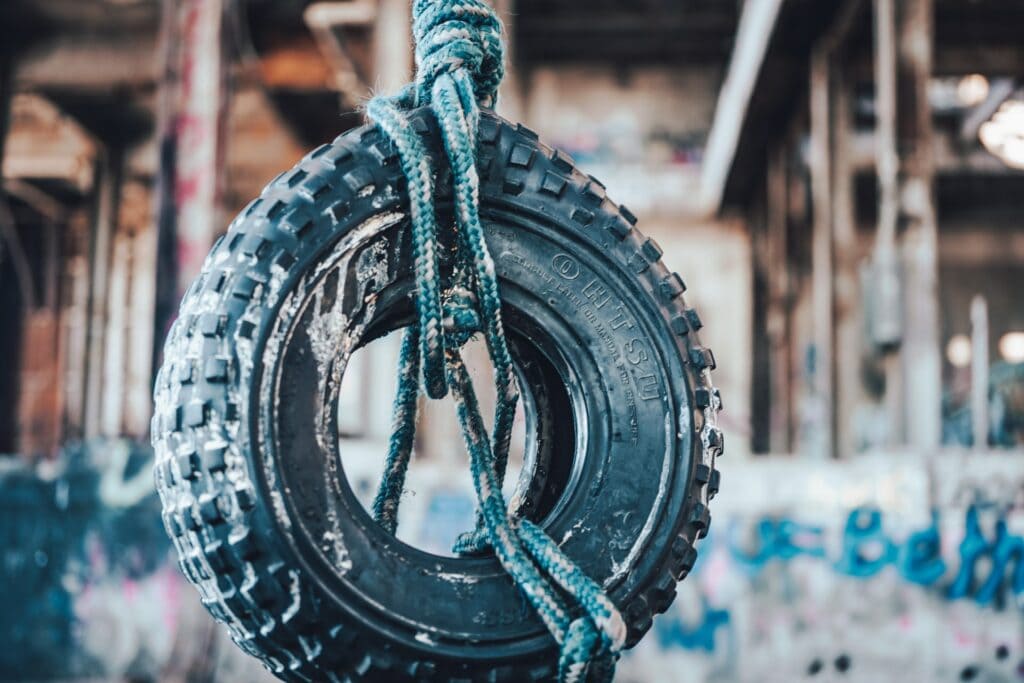blue rope tied on a car tire