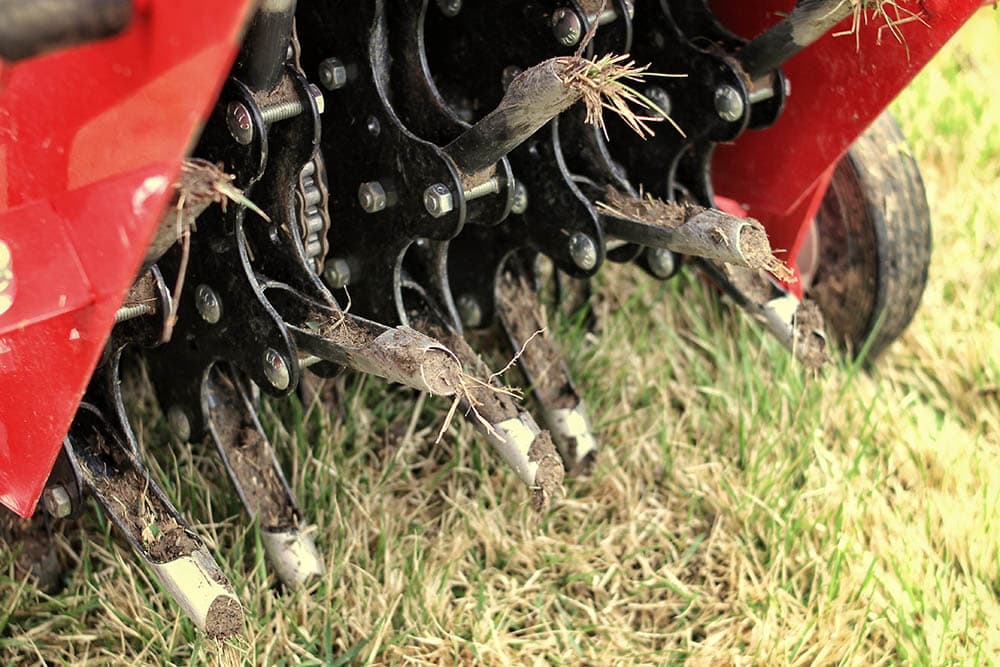 Close up mechanical lawn aerator