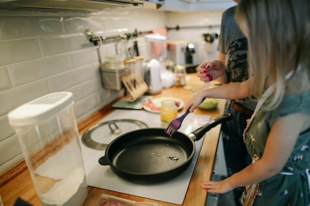 girl cooking in a pan