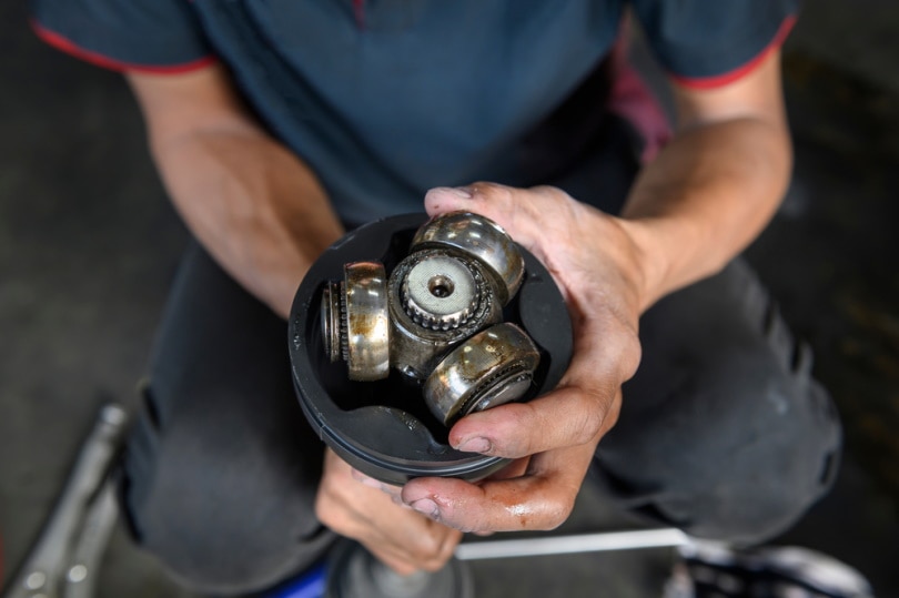 mechanic fixing axel joint