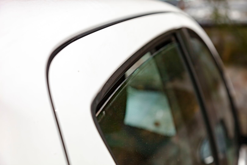 slightly open car window glass