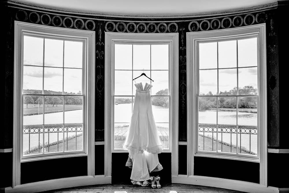 wedding dress on bay sash windows