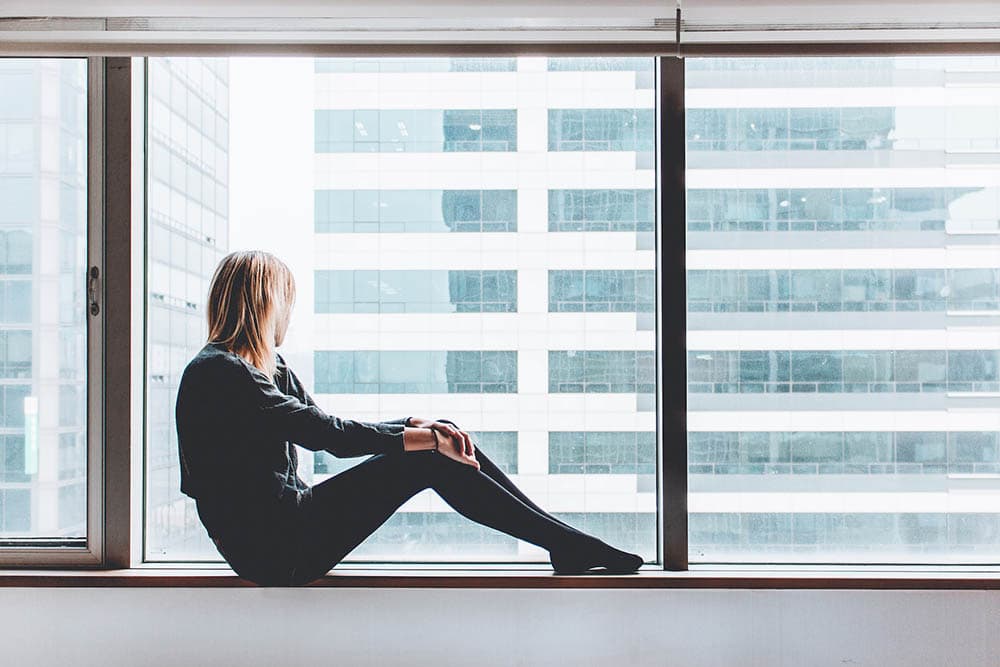 woman sitting by the window