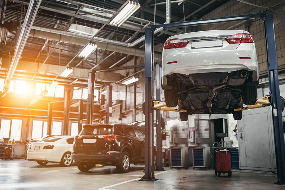 Car raised on car lift in autoservice