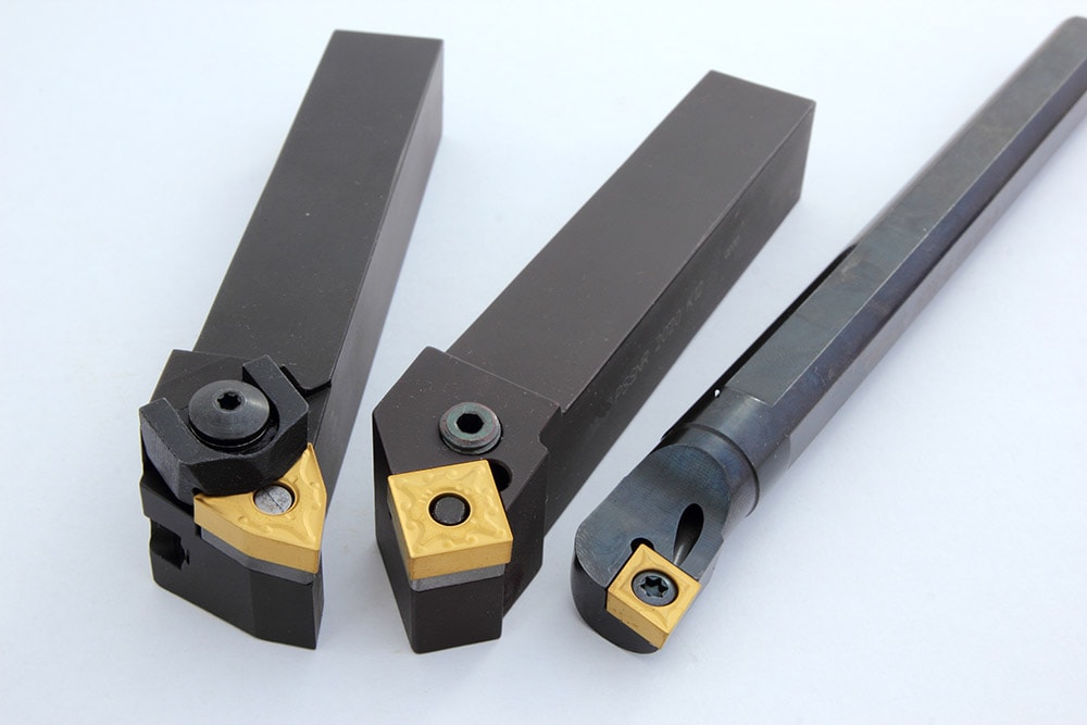 Coated carbide cutting tools for lathe use