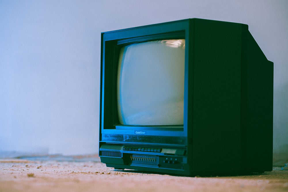 Old TV on rough floor
