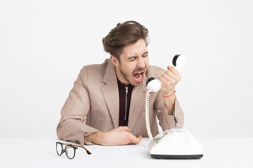 angry man using phone