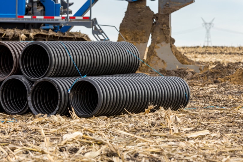 black drainage pipe in the field