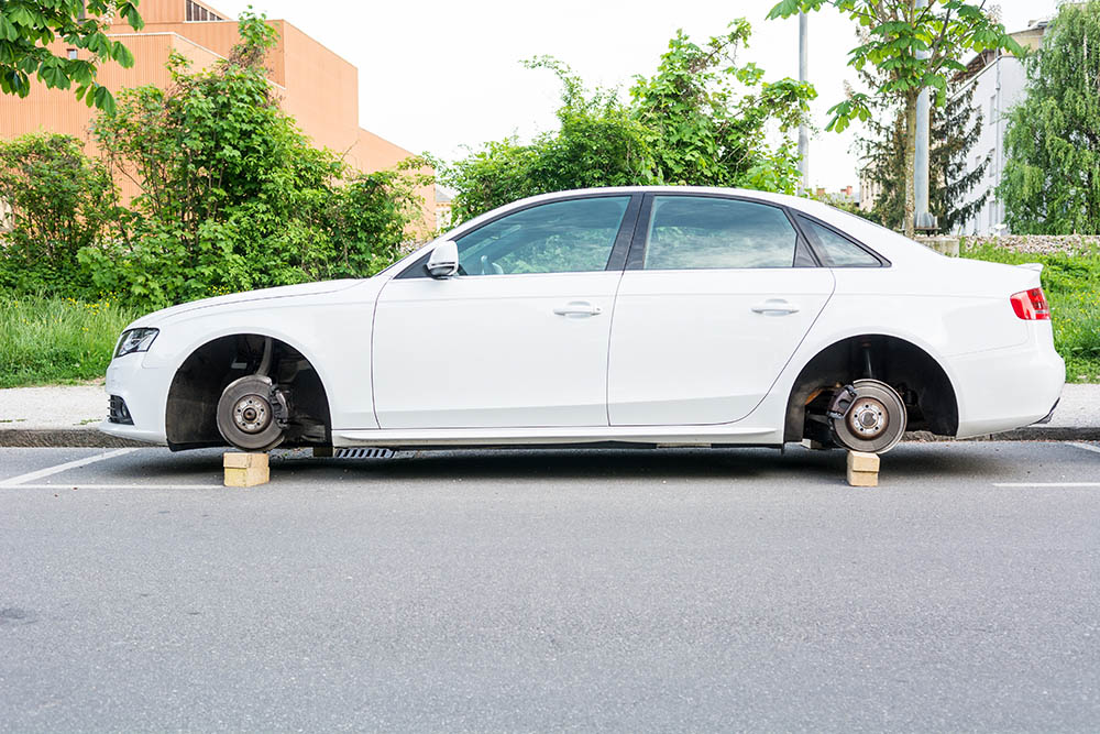 car with stolen wheels