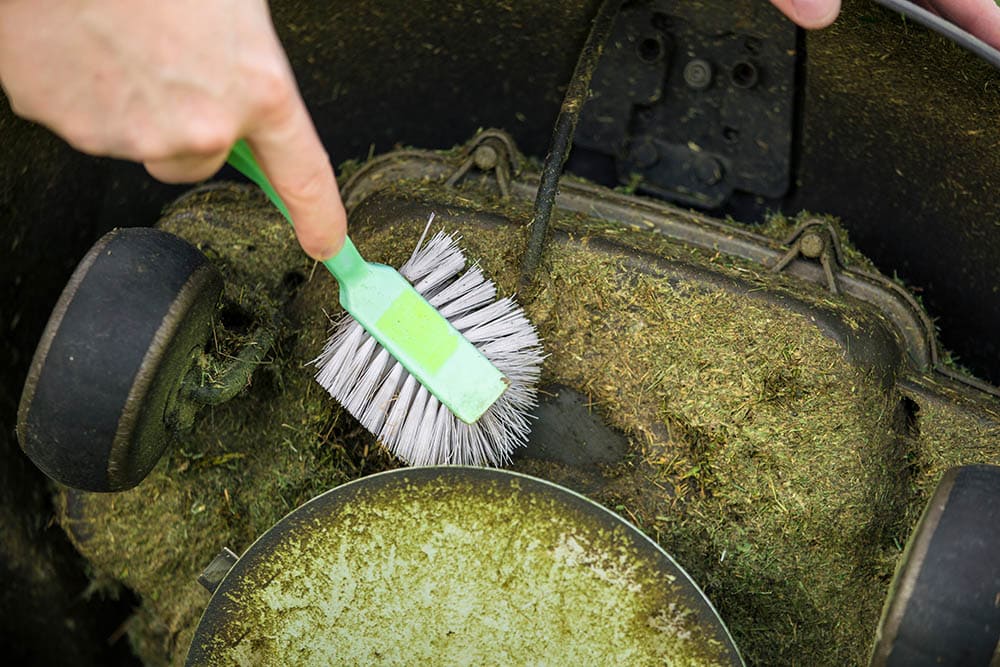 cleaning lawn mower with brush