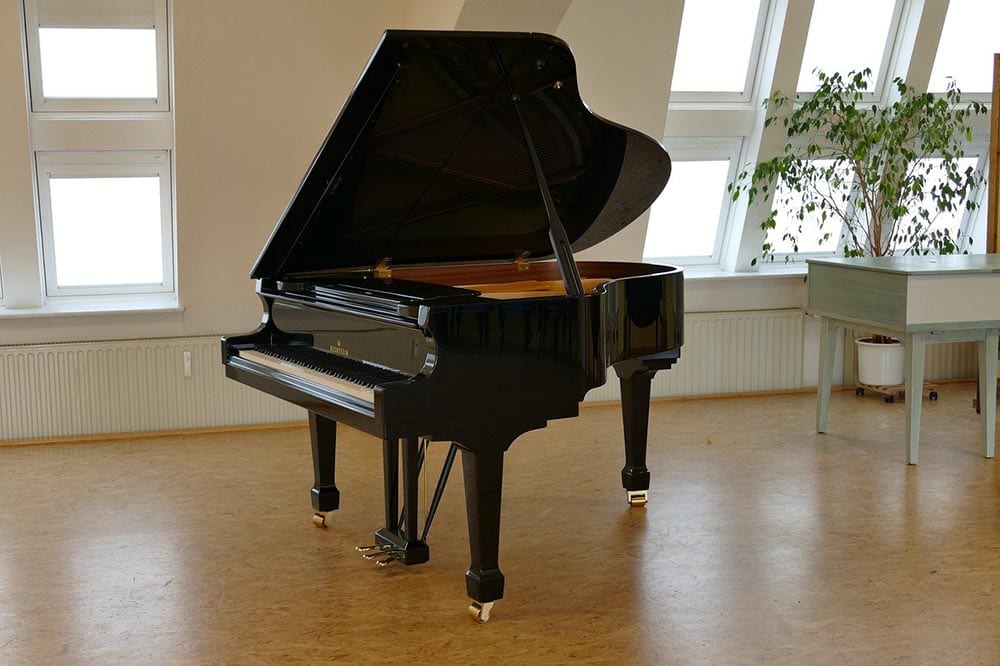 grand piano in the middle of the room