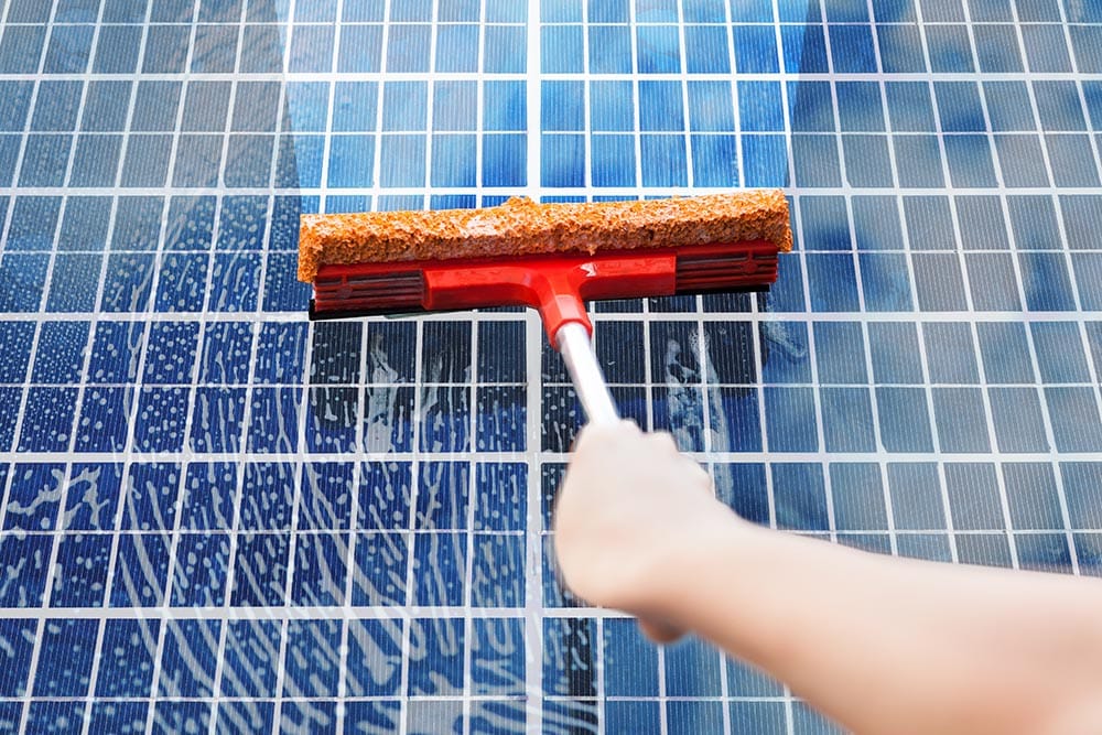 hand cleaning solar panels