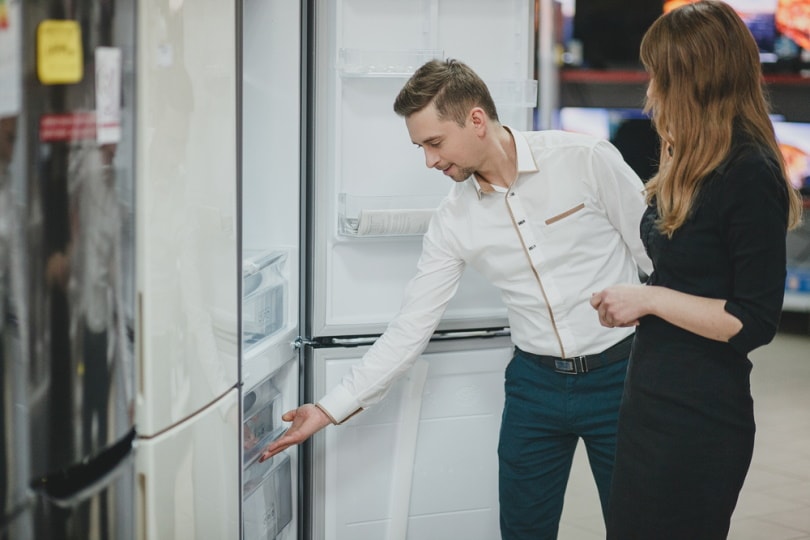 man choosing refrigerator