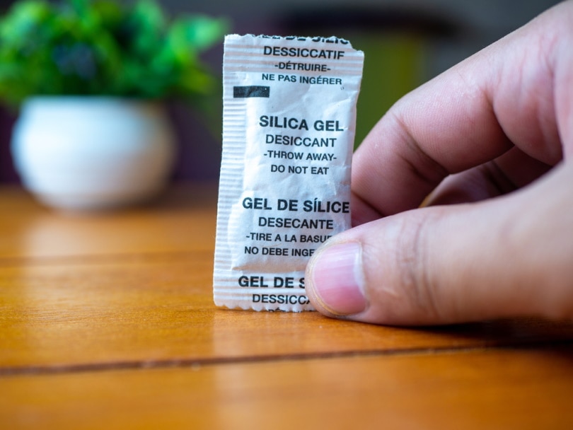 man holding silica gel