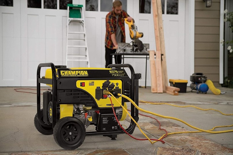 man using Champion portable generator