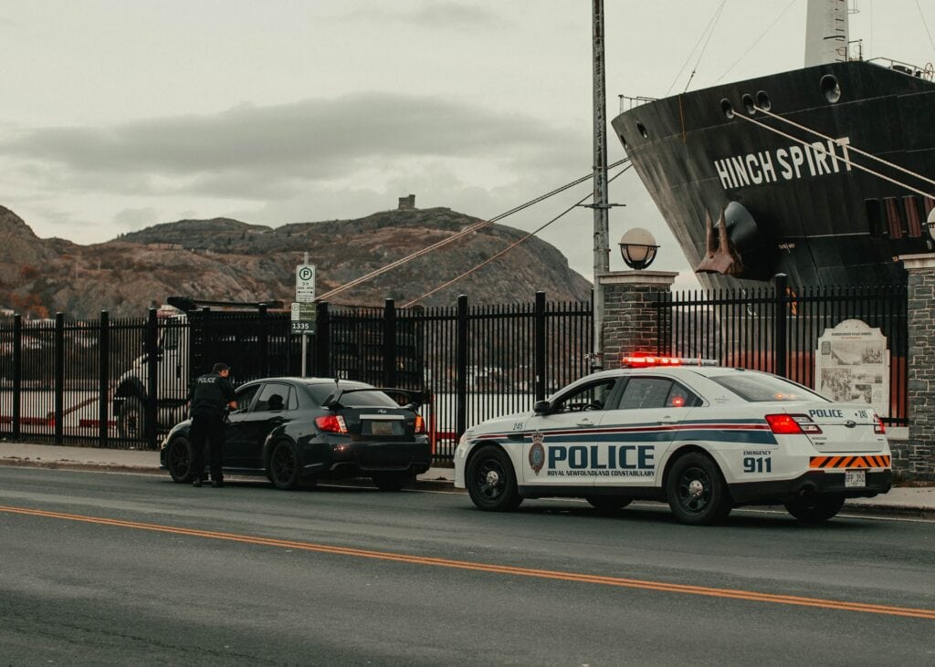 police ticketing a car near pier
